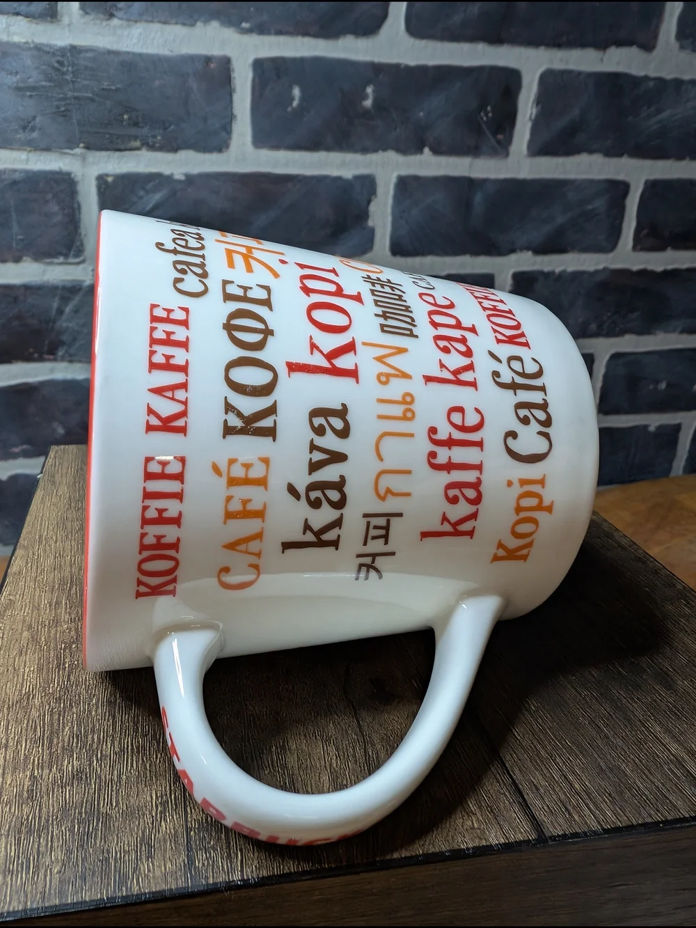 White and Red Coffee Mug with Multilingual 'Coffee' Design